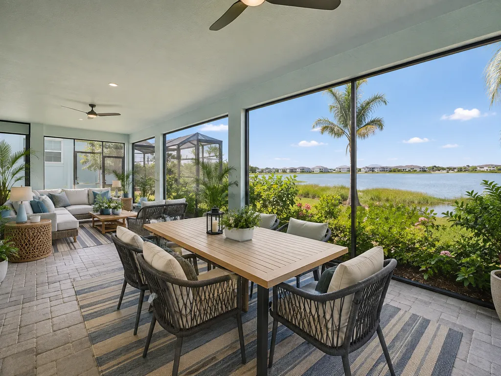 Screened dining terrace overlooking the water