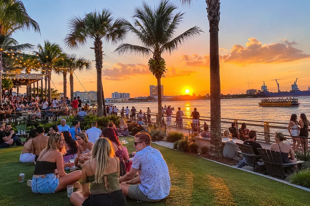 Outdoor waterfront dining at sunset